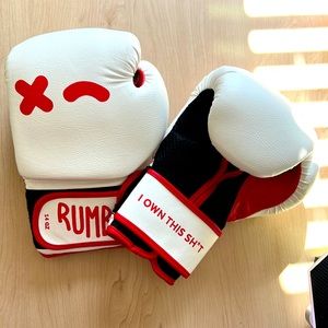 Rumble branded boxing gloves with carrying bag. Never worn.